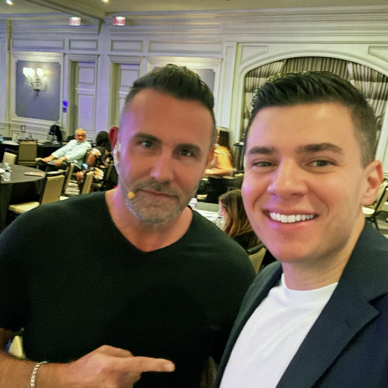 Two attendees posing for a photo