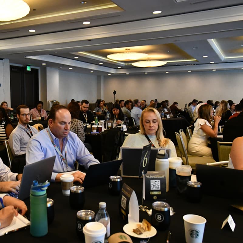 Law firm owners working at round tables